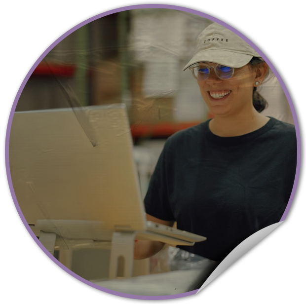 Person using a laptop with a blurred background at TVP NYC