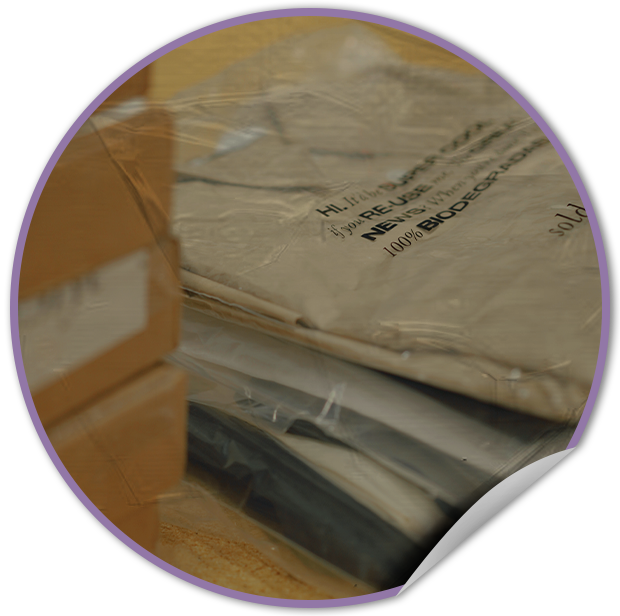 Close-up of a cardboard box with plastic wrap on a white background