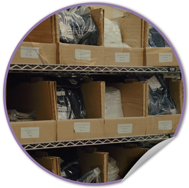 Storage shelves at TVP NYC warehouse with cardboard boxes labeled